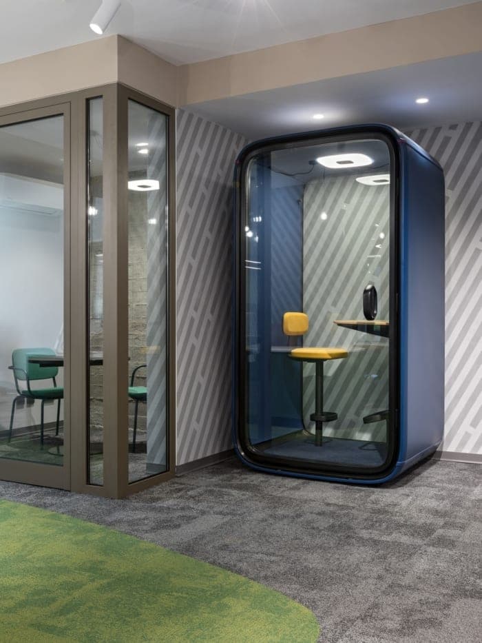 A call booth beside the glass meeting room