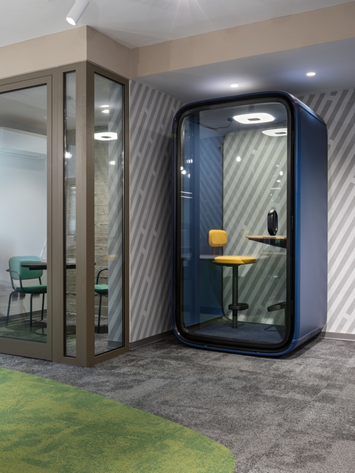 A call booth beside the glass meeting room